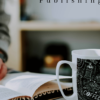 man reading a book in front of the glass of coffee