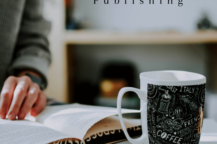 man reading a book in front of the glass of coffee